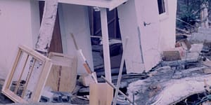 house crumbling from earthquake