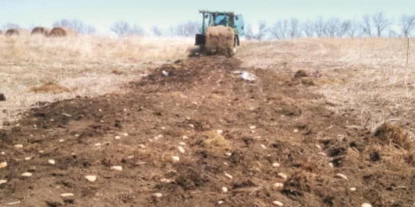bannersnack_tractorpotatoes_dirttosoil tractor and dirt