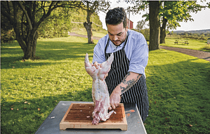 man cuts rabbit
