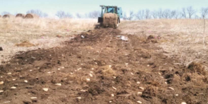 bannersnack_tractorpotatoes_dirttosoil tractor and dirt
