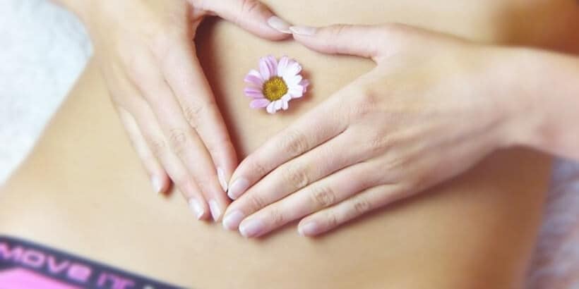 bannersnack_herbal_banner Hands creating heart on bare stomach with a flower in the middle