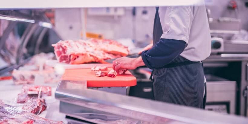 cutting meat chef cutting