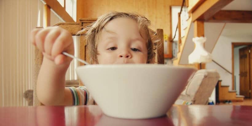 whats making our children sick - banner kid eating out of a bowl