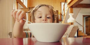 kid eating out of a bowl