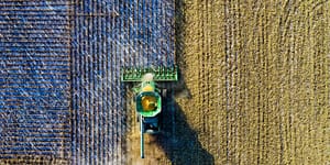 Tractor clearing a field