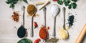 a variety of herbs on spoons